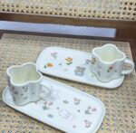 Orange rose ceramic cup